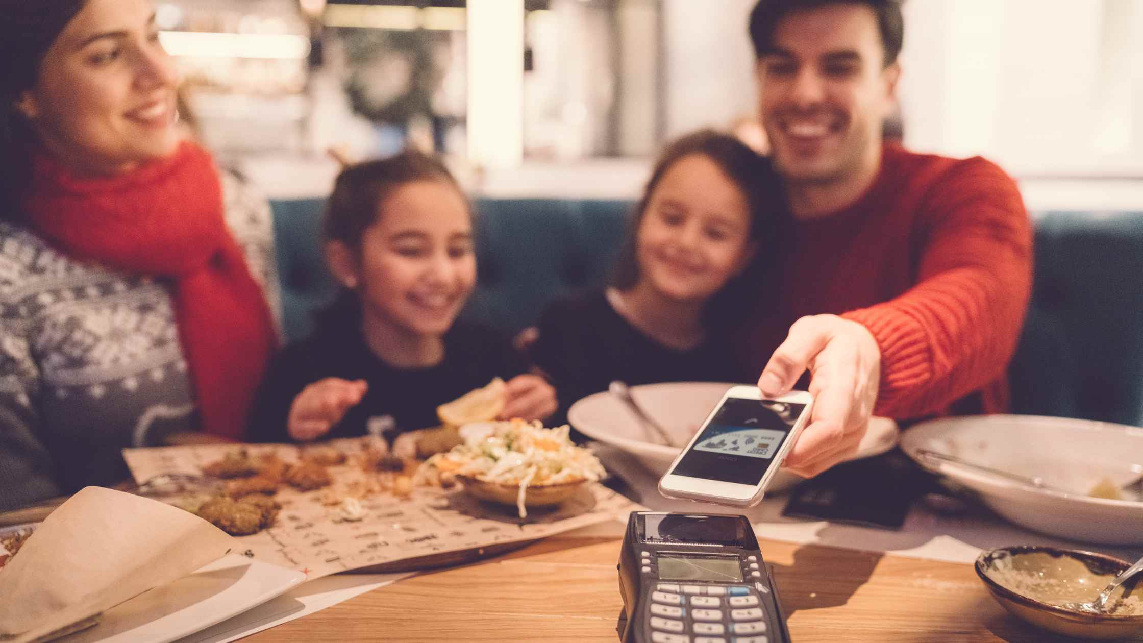paying restaurant with card family